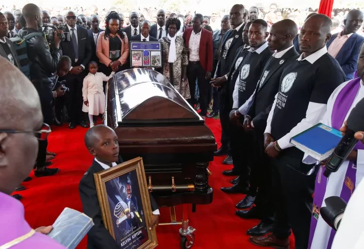 Family members surround the coffin of Kenya's marathon world record holder Kelvin Kiptum