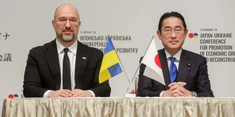 Ukrainian Prime Minister Denys Shmyhal (R) and his Japanese counterpart, Fumio Kishida, in Tokyo, Japan, during the Japan-Ukraine Conference for Promotion of Economic Growth and Reconstruction on Feb. 19, 2024.