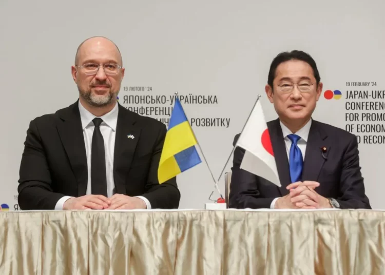 Ukrainian Prime Minister Denys Shmyhal (R) and his Japanese counterpart, Fumio Kishida, in Tokyo, Japan, during the Japan-Ukraine Conference for Promotion of Economic Growth and Reconstruction on Feb. 19, 2024.