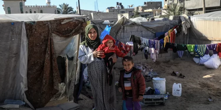Etemad Assaf, an eight months pregnant, displaced woman, fearful of giving birth to her third child in the desperate conditions she is living in at Gaza.