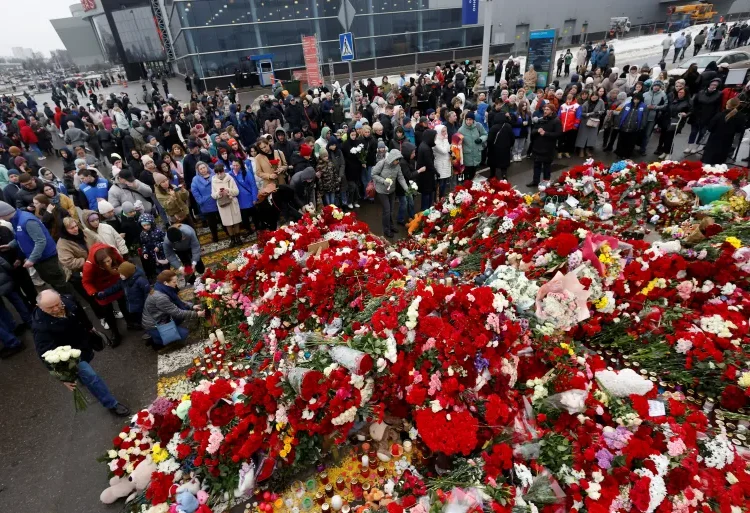 Crocus City Hall Attacks: Russia Claims Evidence Links To "Ukrainian Nationalist" 1 People gather at a makeshift memorial for the victims of a shooting attack set up outside the Crocus City Hall concert venue in the Moscow Region, Russia.