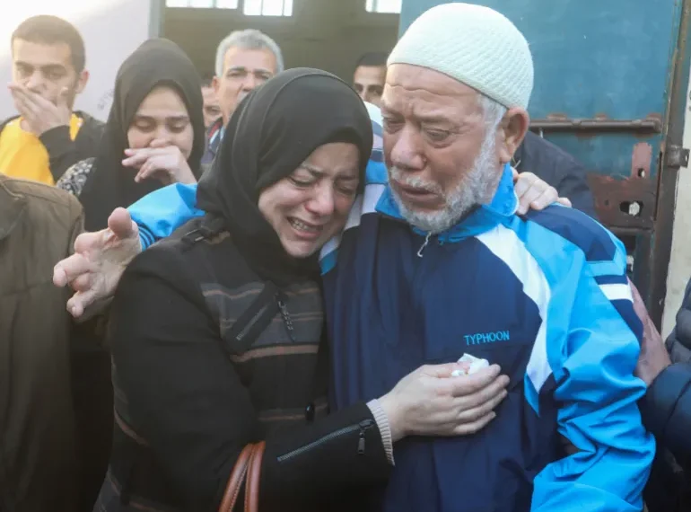 Gaza Death Toll At 32,333 1 People mourn family members killed in Israeli strikes at al-Aqsa Hospital.