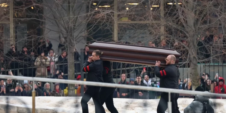 Pallbearers carry the coffin of late Russian opposition leader Alexei Navalny into the Mother of God Quench My Sorrows church for his funeral service, in Moscow's district of Maryino on March 1, 2024.