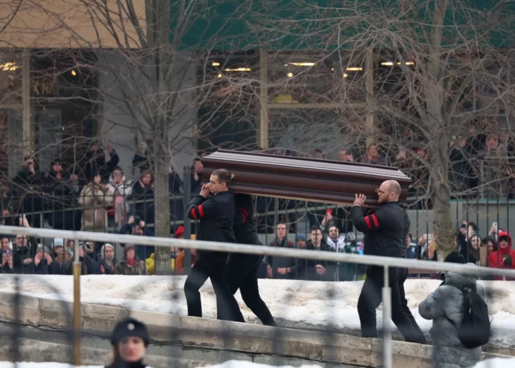 Navalny Laid To Rest 1 Pallbearers carry the coffin of late Russian opposition leader Alexei Navalny into the Mother of God Quench My Sorrows church for his funeral service, in Moscow's district of Maryino on March 1, 2024.