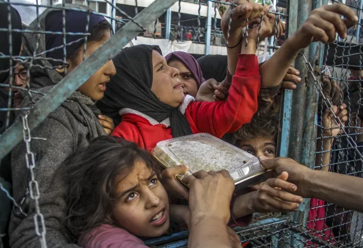 Ceasefire, A Better Choice To Aid Surge 1 A crowd of starving Palestinians wait to receive food in Jabalia refugee camp in northern Gaza on March 27, 2024.