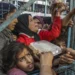 A crowd of starving Palestinians wait to receive food in Jabalia refugee camp in northern Gaza on March 27, 2024.