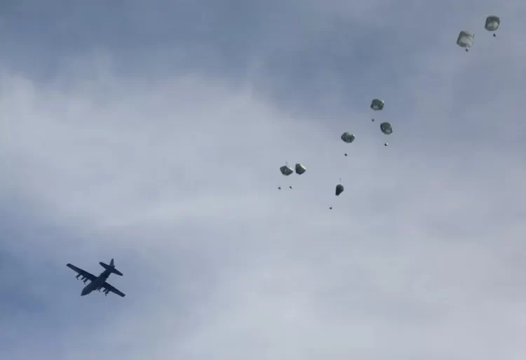 A plane drops aid over Gaza.