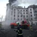 Firefighters work at the site of a building damaged after a Russian attack in Kyiv, Ukraine on Thursday, March 21, 2024.