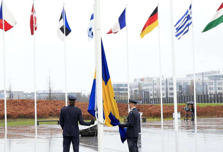 Flag Raising Ceremony Seals Sweden’s NATO Accession 1 Two military personnel prepare to raise the flag of Sweden during a ceremony to mark the accession of Sweden to NATO at NATO headquarters in Brussels, Monday, March 11, 2024.