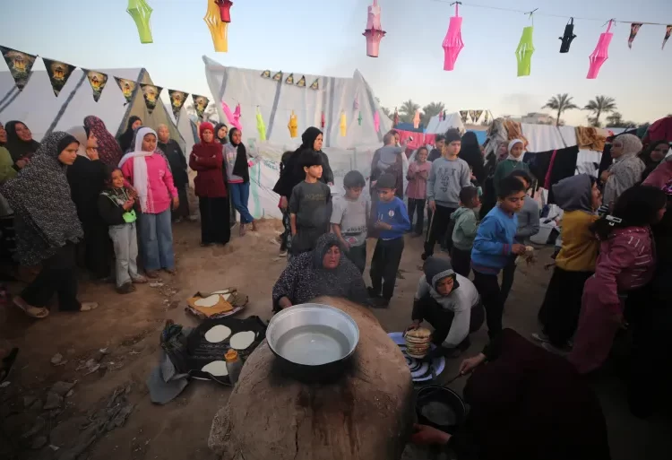 Ramadan Tinged With The Bitter Taste Of War 1 Displaced Palestinians in Deir el-Balah in the central Gaza Strip decorate their tents with lanterns ahead of Ramadan, on March 10, 2024.