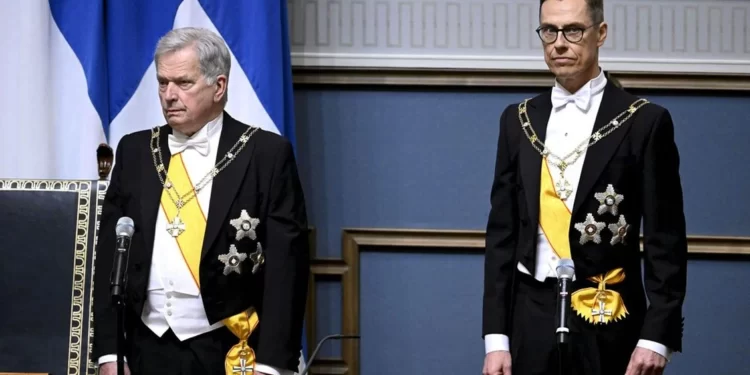Alexander Stubb, right, takes over as President from Sauli Niinisto in Helsinki on March 1, 2024.