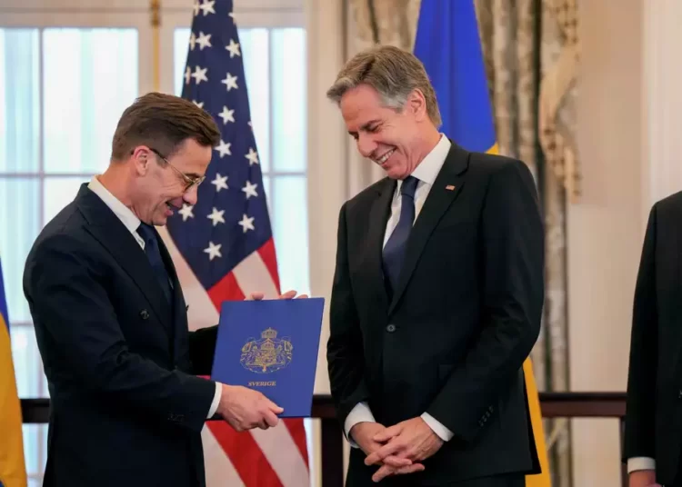U.S Secretary of State Antony Blinken, right, stands with Swedish Prime Minister Ulf Kristersson before presenting Sweden's NATO Instruments of Accession in the Benjamin Franklin Room at the State Department, Thursday, March 7, 2024, in Washington.