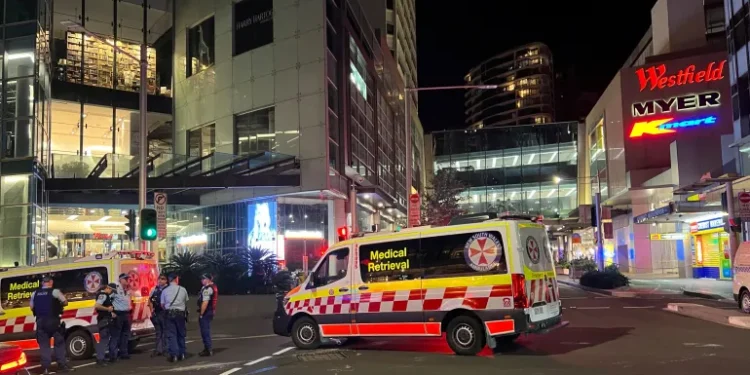Stabbing Attack Leaves Six Dead 1 Police officers work at the scene outside Bondi Junction.