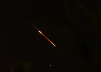 Objects are seen in the sky above Jerusalem after Iran launched drones and missiles towards Israel.