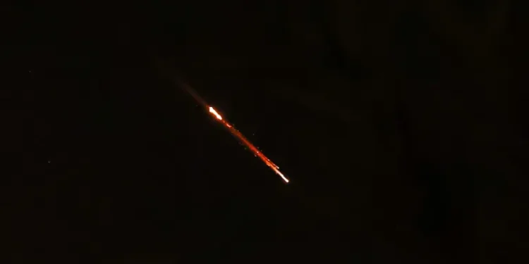 Objects are seen in the sky above Jerusalem after Iran launched drones and missiles towards Israel.
