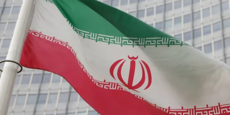 The Iranian flag flutters outside the International Atomic Energy Agency (IAEA) headquarters in Vienna, Austria.
