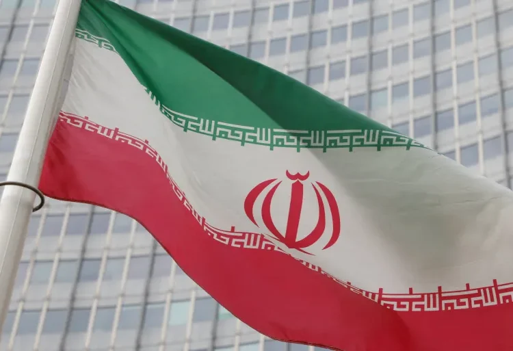 The Iranian flag flutters outside the International Atomic Energy Agency (IAEA) headquarters in Vienna, Austria.
