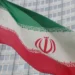 The Iranian flag flutters outside the International Atomic Energy Agency (IAEA) headquarters in Vienna, Austria.