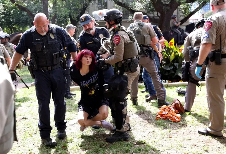 Virus of Intimidation Plagues U.S’ Future Leaders 1 Law enforcement carry a pro-Palestinian protester at the University of Texas at Austin.