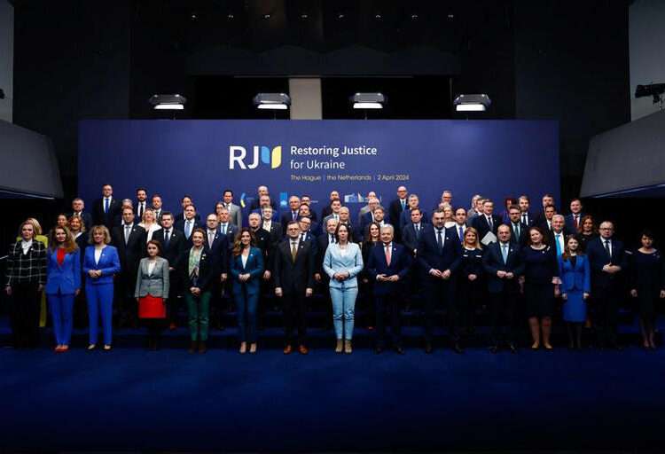Attendees of the international peace conference 'Restoring Justice for Ukraine' pose for a family photo, in The Hague, Netherlands, April 2, 2024.
