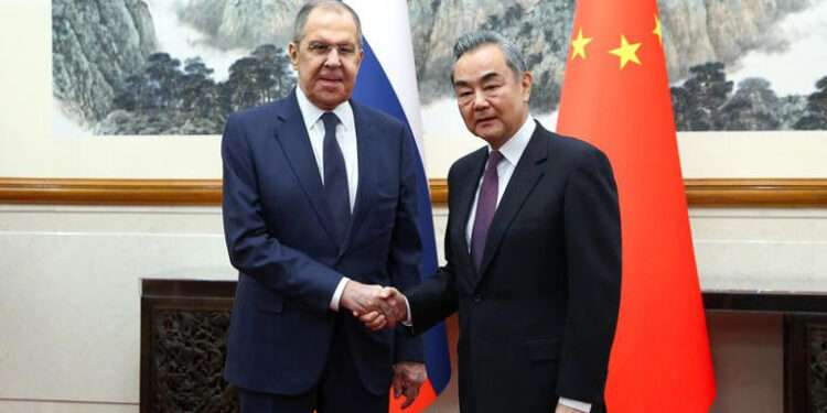Russia's Foreign Minister Sergei Lavrov shakes hands with China's Foreign Minister Wang Yi during a meeting in Beijing, China April 9, 2024.