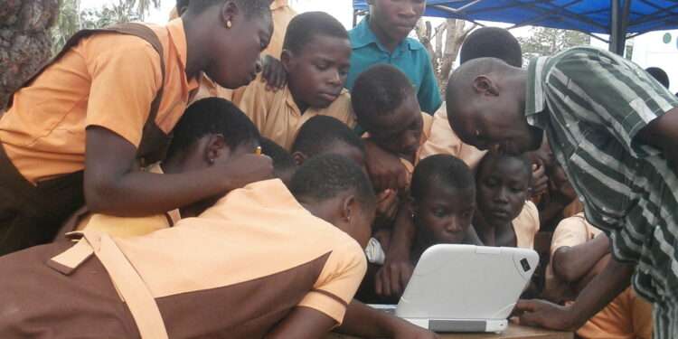 Public Basic Students Having hands-on computer classes