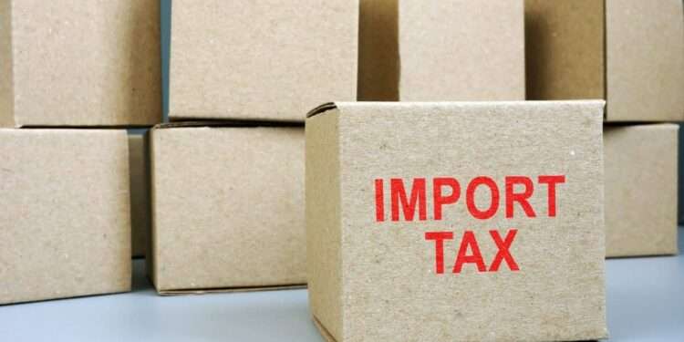 The Double-Edged Sword of Import Duties 1 Import tax red stamp on cardboard box.