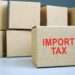 The Double-Edged Sword of Import Duties 11 Import tax red stamp on cardboard box.
