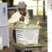 10 Presidential Aspirants Form ‘Grand Coalition, Ghana’ 12 A man casting his Vote