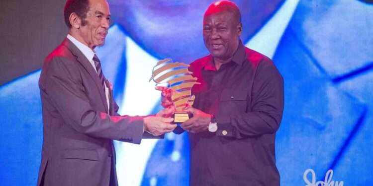 Former President John Dramani Mahama receives his Award