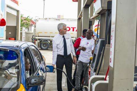 managing director of total ghana eric fanchini despensing fuel