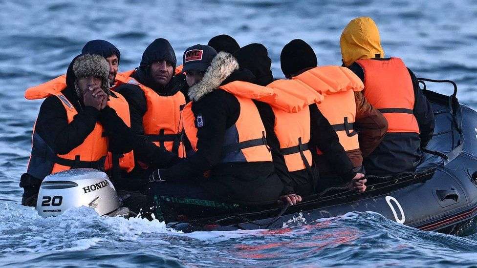 migrants crossing the English Channel in a small boat
