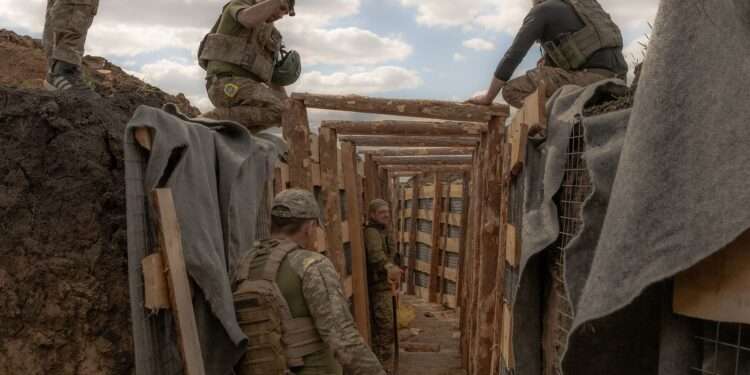 EU Reaches Deal To Use Profits From Russia’s Frozen Assets 1 Ukrainian servicemen prepare a trench system in the Donetsk region.