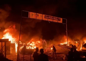 Fire rages following an Israeli strike on a tent camp for displaced Palestinian in Rafah.