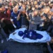 Colleagues and family members pray at the funeral of Al Jazeera cameraman Samer Abudaqa in Khan Younis, Gaza.