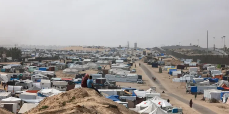 Palestinians Ordered To Evacuate Eastern Rafah 1 Displaced Palestinian children sit on a dune overlooking their tent camp in Rafah in the southern Gaza.