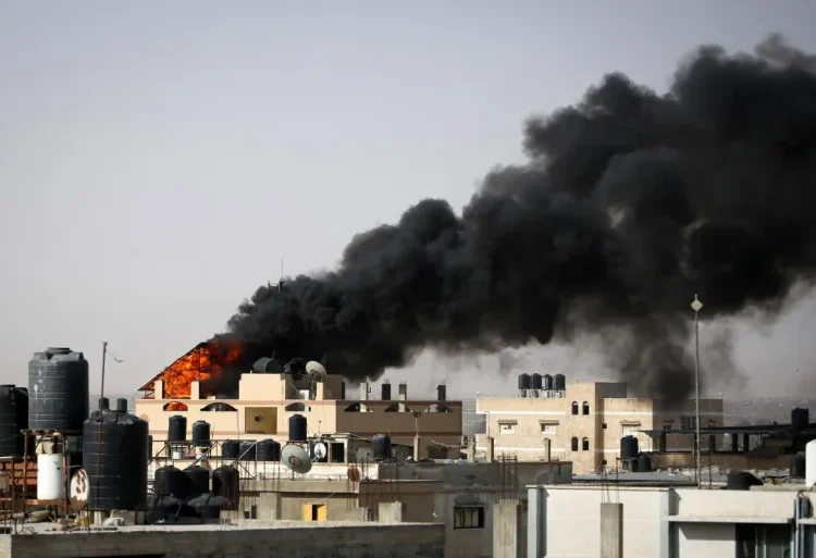 Smoke rises from a fire in a building caused by Israel’s bombardment in Rafah on May 10, 2024.
