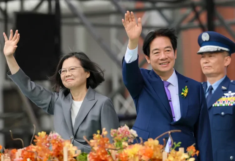Taiwan's new President, William Lai Ching-te (right) waves alongside outgoing President, Tsai Ing-wen during the inauguration ceremony.
