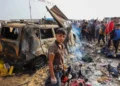 Palestinians gather at the site of an Israeli attack on a camp area housing internally displaced people in Rafah on May 27, 2024.