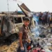 Palestinians gather at the site of an Israeli attack on a camp area housing internally displaced people in Rafah on May 27, 2024.