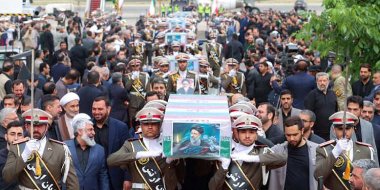Raisi’s Body Sent To Tehran 1 Soldiers carry the coffin of the late Iranian President, Ebrahim Raisi at Mehrabad Airport in Tehran.