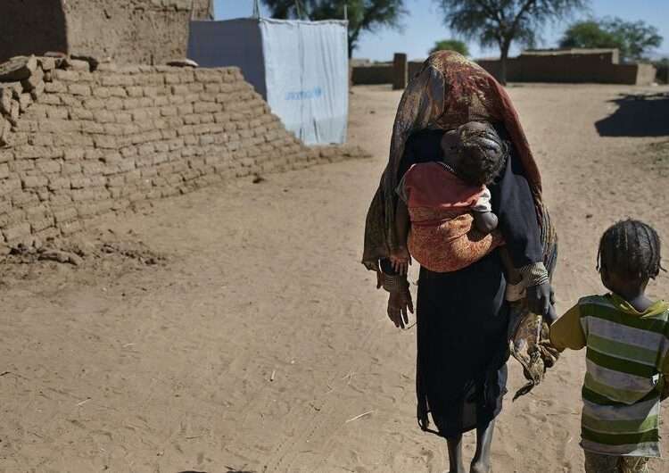 Children walking to their shelter at an IDP camp near Al Fasher, the capital of North Darfur, Sudan