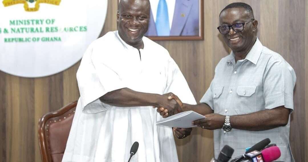 Hon. Samuel A. Jinapor receives report from Hon. Andy Kwame Appiah Kubi