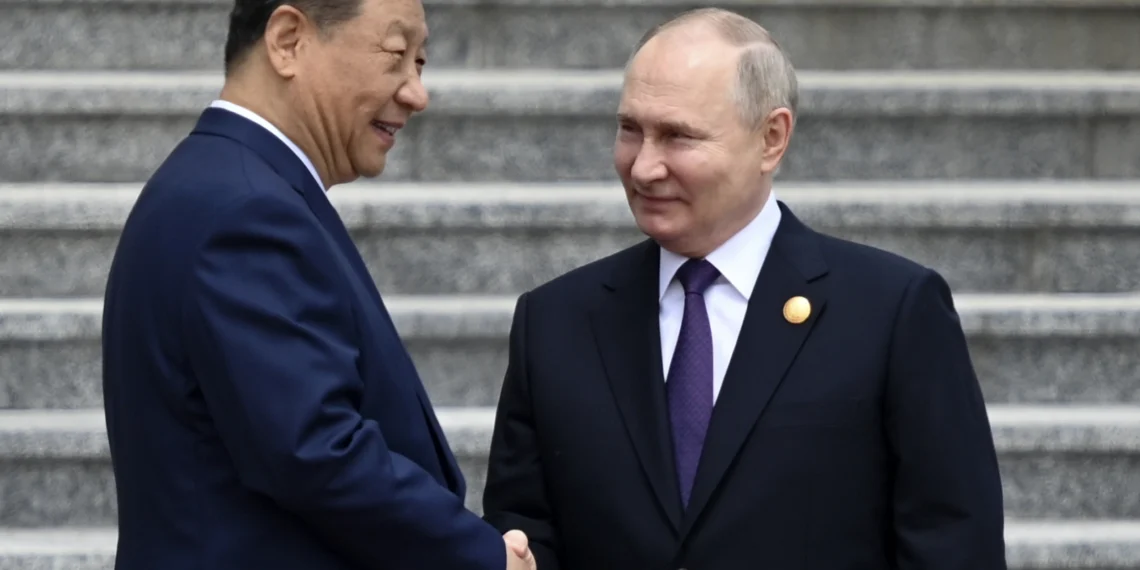 Russia's President Vladimir Putin and China's President Xi Jinping attend an official welcoming ceremony in front of the Great Hall of the People in Tiananmen Square in Beijing on May 16, 2024.
