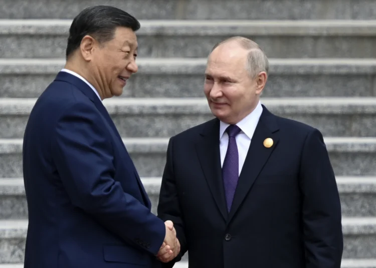 Russia's President Vladimir Putin and China's President Xi Jinping attend an official welcoming ceremony in front of the Great Hall of the People in Tiananmen Square in Beijing on May 16, 2024.