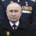 Russian President, Vladimir Putin sits during the Victory Day military parade on May 9, 2024.