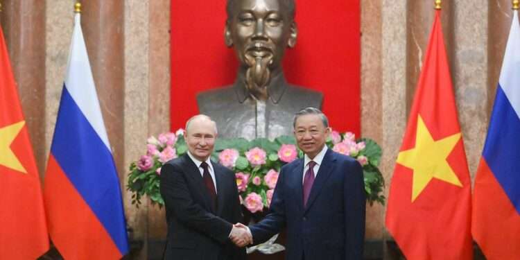 Russian President Vladimir Putin and Vietnamese President To Lam.