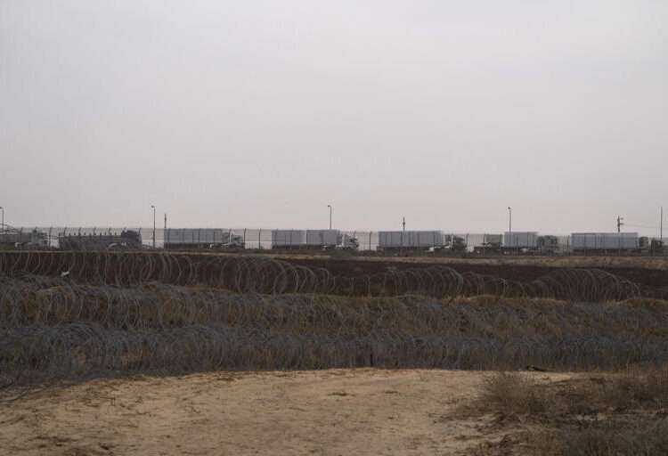 Gaza Aid Stockpiling Outside Border 1 Trucks, carrying humanitarian supplies for the Gaza Strip, wait in line on the Egyptian side, at the Kerem Shalom Crossing border as seen from southern Israel, on April 25, 2024.