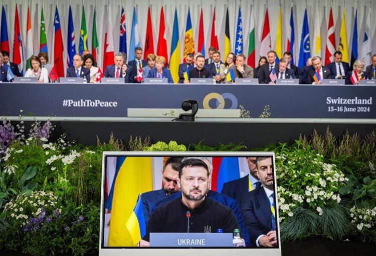 Peace In Ukraine Unattainable In A Single Step 1 Ukrainian President, Volodymyr Zelenskyy is pictured on a monitor as he attends the plenary session of the Summit on peace in Ukraine, in Stansstad near Lucerne, Switzerland, June 16, 2024.