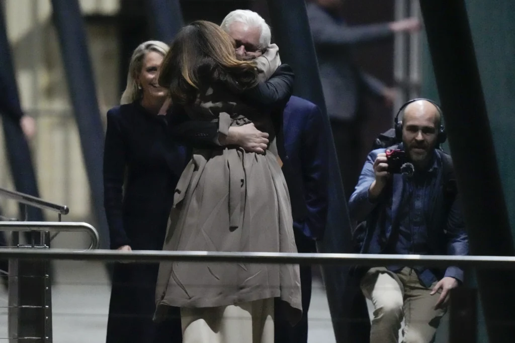 Julian Assange embraces his wife Stella after landing in Canberra Australia